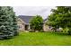 Beautiful brick and yellow siding home with a large, well-manicured green lawn and mature trees at 1020 Lair Ct, Westfield, IN 46074