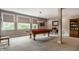 An inviting game room featuring a pool table, large windows, and comfortable seating to enjoy indoor entertainment at 1020 Lair Ct, Westfield, IN 46074