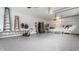 Clean, well-lit garage with epoxy flooring and ample storage space at 1020 Lair Ct, Westfield, IN 46074