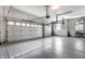 Spacious garage with epoxy flooring, high ceilings, and two overhead doors at 1020 Lair Ct, Westfield, IN 46074