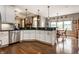 Well-lit kitchen showcasing stainless steel appliances, granite countertops, and hardwood floors at 1020 Lair Ct, Westfield, IN 46074