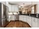 Modern kitchen featuring stainless steel appliances, granite countertops, and hardwood floors at 1020 Lair Ct, Westfield, IN 46074