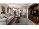 Spacious living room with hardwood floors, a neutral color palette, and a built-in entertainment center at 1020 Lair Ct, Westfield, IN 46074