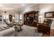 Well-lit living room featuring hardwood floors, comfortable seating, and a large entertainment center at 1020 Lair Ct, Westfield, IN 46074