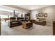 A spacious living room featuring comfortable leather seating, a coffee table, and easy access to recreation at 1020 Lair Ct, Westfield, IN 46074