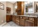Stylish bathroom with double sinks, granite countertops, and a beautiful wood-finished vanity at 1020 Lair Ct, Westfield, IN 46074