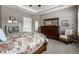 Bright and airy main bedroom with hardwood furnishings and a view of the open-concept bathroom at 1020 Lair Ct, Westfield, IN 46074