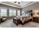 Inviting main bedroom with tray ceiling, large windows, and neutral tones, providing a relaxing retreat at 1020 Lair Ct, Westfield, IN 46074