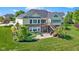 Landscaped backyard with deck and paver patio of this two-story home at 1020 Lair Ct, Westfield, IN 46074
