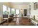 Cozy sunroom with access to outdoor deck, lots of natural light, and seating for dining or relaxing at 1020 Lair Ct, Westfield, IN 46074
