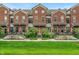 Charming townhomes with brick facade, manicured lawns, and inviting front entrances at 1064 Reserve Way, Indianapolis, IN 46220
