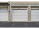 Attached garages with white doors and stone accents provide secure parking and curb appeal at 1064 Reserve Way, Indianapolis, IN 46220