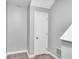 Hallway features tile flooring and a white door offering access to storage or another room at 1064 Reserve Way, Indianapolis, IN 46220