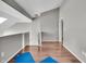 Hallway with hardwood floors features an open stairway and access to other rooms at 1064 Reserve Way, Indianapolis, IN 46220