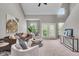 Bright living room featuring a ceiling fan, neutral decor, and modern furniture at 1064 Reserve Way, Indianapolis, IN 46220