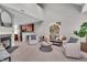 Bright living room featuring a fireplace, neutral decor, and modern furniture at 1064 Reserve Way, Indianapolis, IN 46220