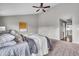 Airy primary bedroom with a modern ceiling fan, plush carpets, and plenty of light at 1064 Reserve Way, Indianapolis, IN 46220