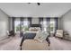Primary bedroom featuring large windows and a seating area, perfect for relaxing at 1064 Reserve Way, Indianapolis, IN 46220