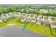 This aerial view showcases the neighborhood homes near a pond, creating a picturesque and community-oriented setting at 10731 Jimmy Lake Dr, Indianapolis, IN 46239