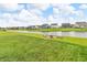 Peaceful backyard with a fire pit and pond view, providing a serene and inviting outdoor space for relaxation and gatherings at 10731 Jimmy Lake Dr, Indianapolis, IN 46239