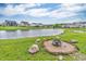 Scenic backyard featuring a picturesque pond with a fire pit, offering a serene and relaxing outdoor space at 10731 Jimmy Lake Dr, Indianapolis, IN 46239