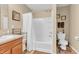 Bright bathroom with a shower-tub combo, single sink vanity, and neutral tones at 10731 Jimmy Lake Dr, Indianapolis, IN 46239