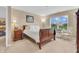 Comfortable bedroom featuring a large window with natural light, neutral decor, and ample closet space at 10731 Jimmy Lake Dr, Indianapolis, IN 46239