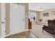 Inviting foyer leading into a sunlit living room with a comfortable couch and large window at 10731 Jimmy Lake Dr, Indianapolis, IN 46239