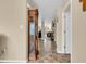 Inviting hallway with tiled floor, leading to bright living spaces and showcasing a grandfather clock at 10731 Jimmy Lake Dr, Indianapolis, IN 46239