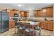 Well-equipped kitchen with stainless steel appliances, an island with bar stools, and lots of storage at 10731 Jimmy Lake Dr, Indianapolis, IN 46239