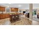 Spacious open-concept kitchen featuring an island with bar seating and seamless flow into the living area at 10731 Jimmy Lake Dr, Indianapolis, IN 46239