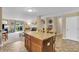 Open-concept kitchen with a large island, seamless access to the living room, and bright interiors at 10731 Jimmy Lake Dr, Indianapolis, IN 46239