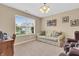 Cozy living room with beige walls, plush sofa, natural lighting, and comfortable furniture at 10731 Jimmy Lake Dr, Indianapolis, IN 46239