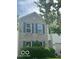 Charming two-story home with light brick, dark shutters and well-manicured landscaping at 10746 Raven Ct, Fishers, IN 46038