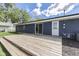View of the home's back exterior and wooden deck at 1082 Galaxie Dr, Greenwood, IN 46142