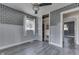 Bedroom with light gray walls, hardwood floors, and a modern sliding door closet at 1082 Galaxie Dr, Greenwood, IN 46142