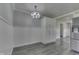 Bright dining area with stylish lighting fixture and access to the modern kitchen at 1082 Galaxie Dr, Greenwood, IN 46142