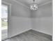 Bright dining area with stylish lighting and a view of the outdoor patio through sliding doors at 1082 Galaxie Dr, Greenwood, IN 46142