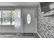Entryway showcases a decorative front door, a large bright window with sheer curtains, and a modern accent wall at 1082 Galaxie Dr, Greenwood, IN 46142