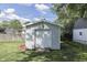 View of the detached garage featuring a white exterior and roll up door at 1082 Galaxie Dr, Greenwood, IN 46142