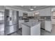 Bright kitchen featuring stainless steel appliances, a center island, and white cabinets at 1082 Galaxie Dr, Greenwood, IN 46142