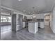 Spacious kitchen with stainless steel appliances, white cabinets, and a center island at 1082 Galaxie Dr, Greenwood, IN 46142