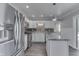 Modern kitchen featuring stainless steel appliances, white cabinetry, and a stylish island at 1082 Galaxie Dr, Greenwood, IN 46142