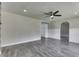 Spacious living room features gray flooring, neutral paint, recessed lighting, and easy access to other rooms at 1082 Galaxie Dr, Greenwood, IN 46142