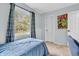 Comfortable bedroom with large window offering a view to outside play area at 1104 Briarwood Dr, Brownsburg, IN 46112