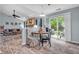 Cozy dining area with a view of the living room and backyard through sliding glass doors at 1104 Briarwood Dr, Brownsburg, IN 46112