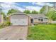 Charming home showcasing a well-manicured front yard and attached two-car garage at 1104 Briarwood Dr, Brownsburg, IN 46112
