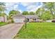 Well-maintained home with a welcoming front yard, attached garage, and a charming 'Welcome' sign at 1104 Briarwood Dr, Brownsburg, IN 46112