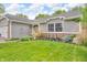 Beautiful home with brick and vinyl exterior accents and vibrant landscaping at 1104 Briarwood Dr, Brownsburg, IN 46112
