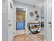 Inviting hallway with console table and decorative wall art leads to bathroom at 1104 Briarwood Dr, Brownsburg, IN 46112